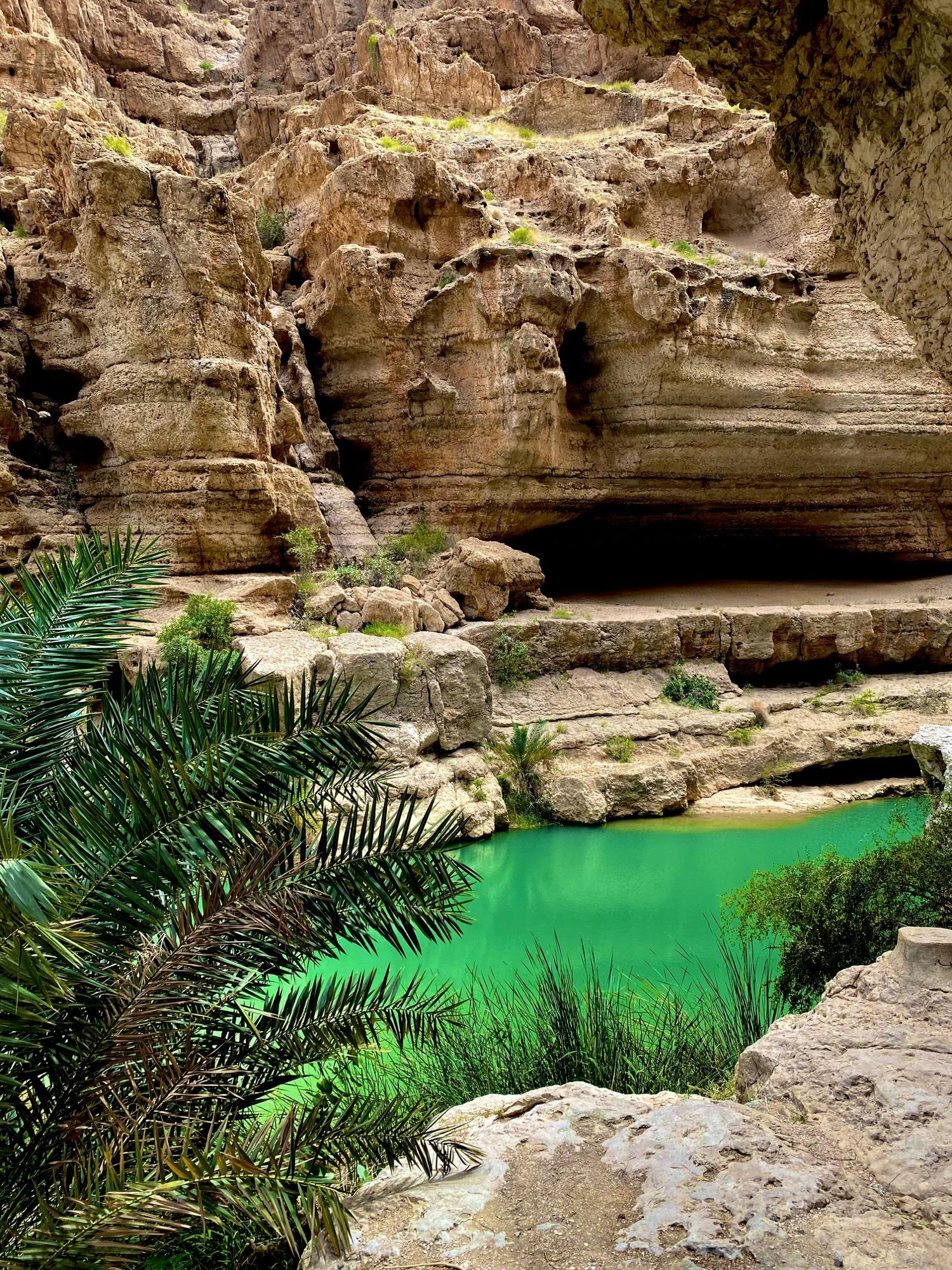 Emerald water in Wadi Tiwi, a hidden gem between the mountains
