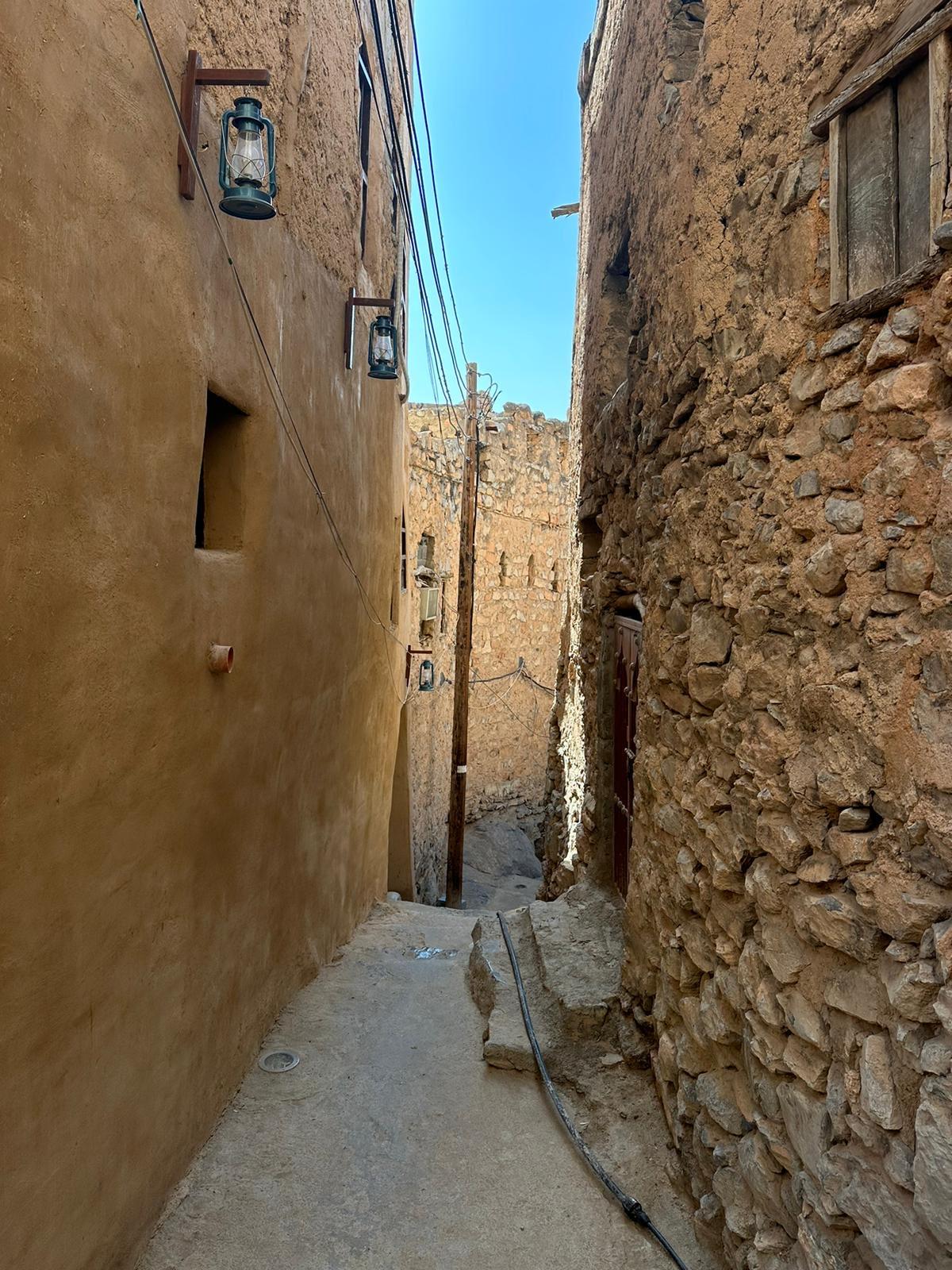 Lantern-lit alley in a centuries-old mountain village
