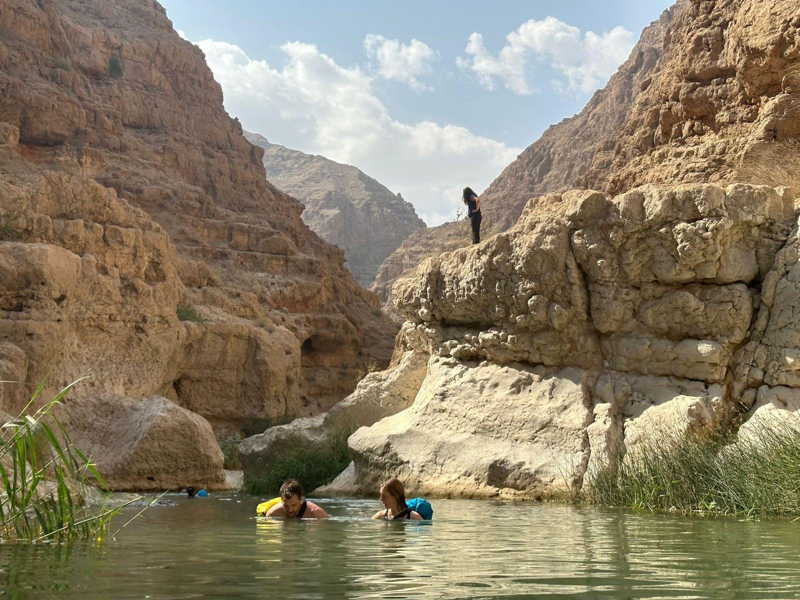 Swimming in a wadi between the canyon walls