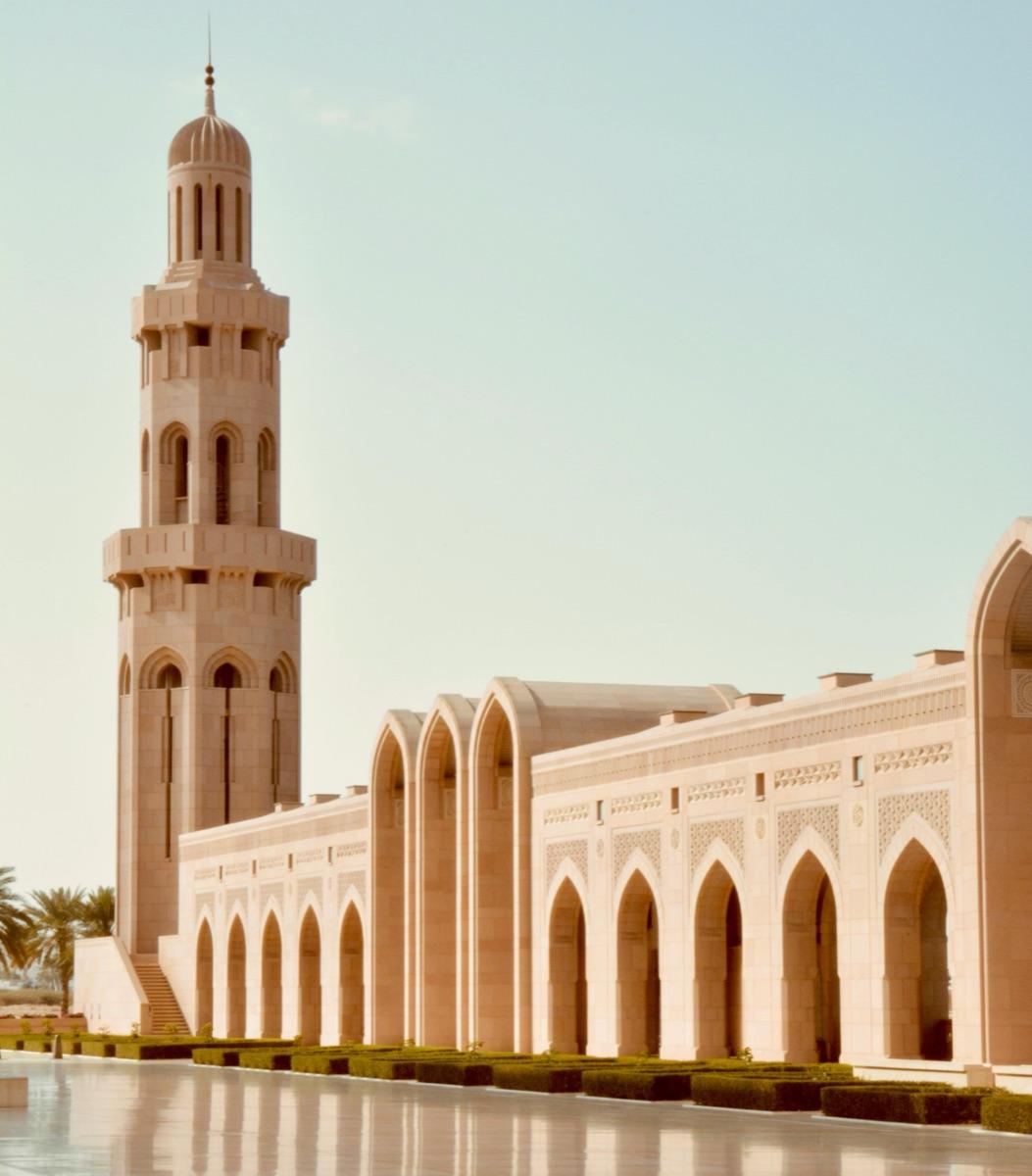 The Sultan Qaboos Grand Mosque in Muscat in warm evening light