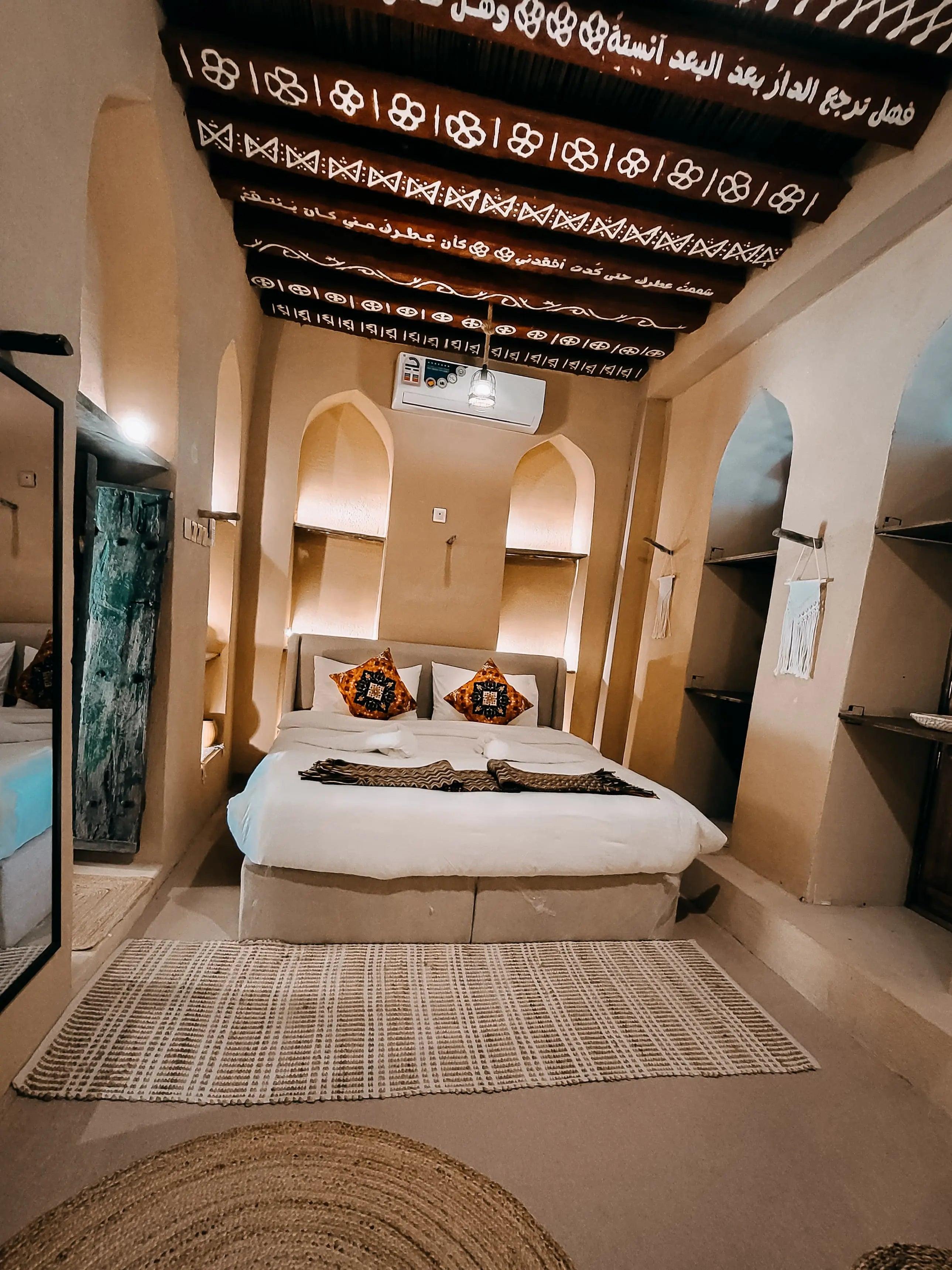 Restored heritage house with painted ceiling beams in an Omani mountain village