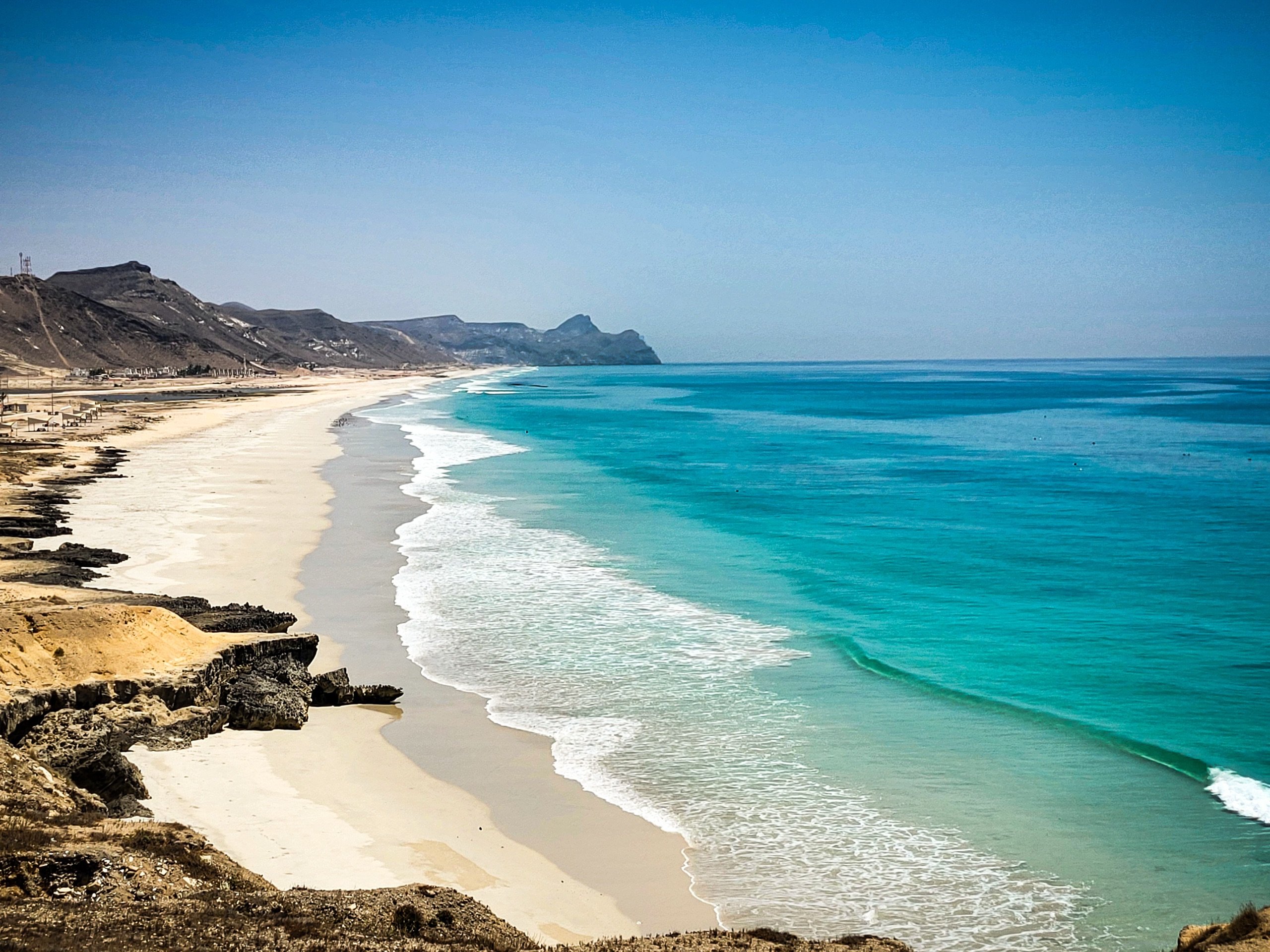 White sand and turquoise sea along the coast of Salalah